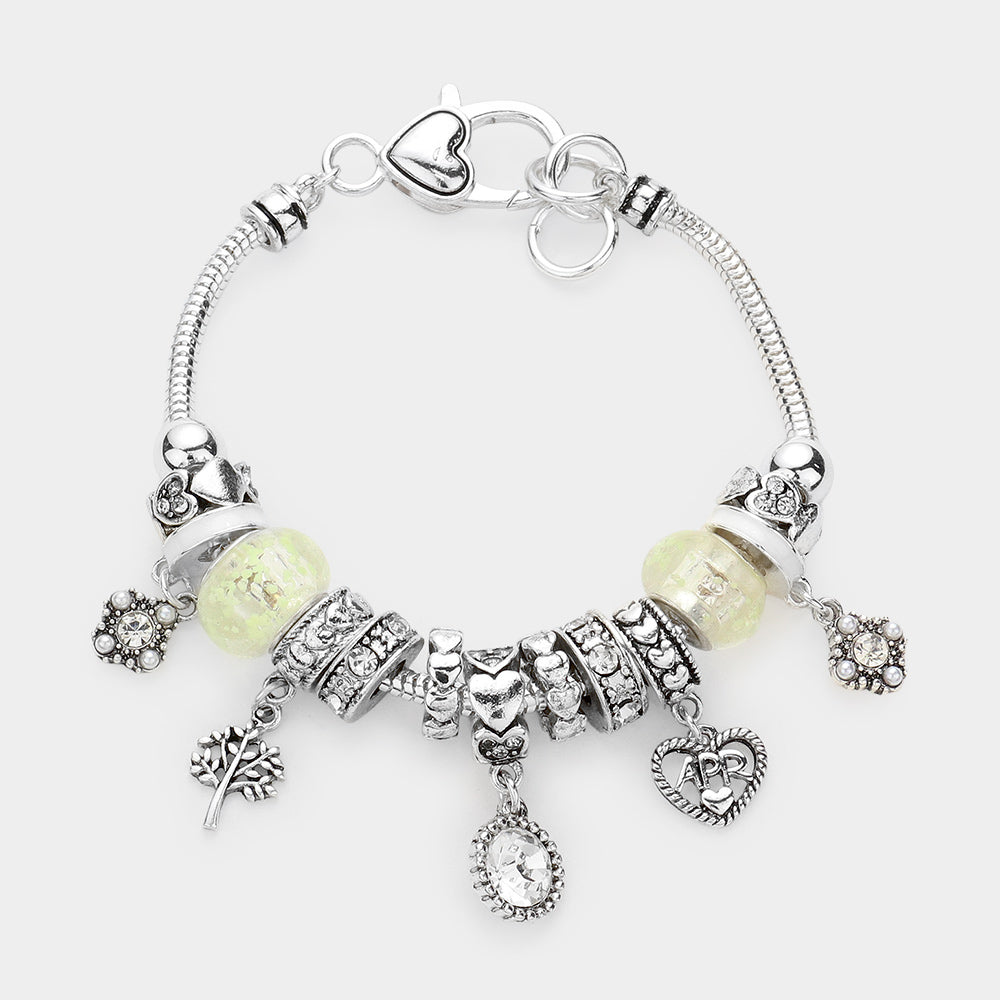 Meses - Pulsera con múltiples charms y dije de corazón con piedra natal