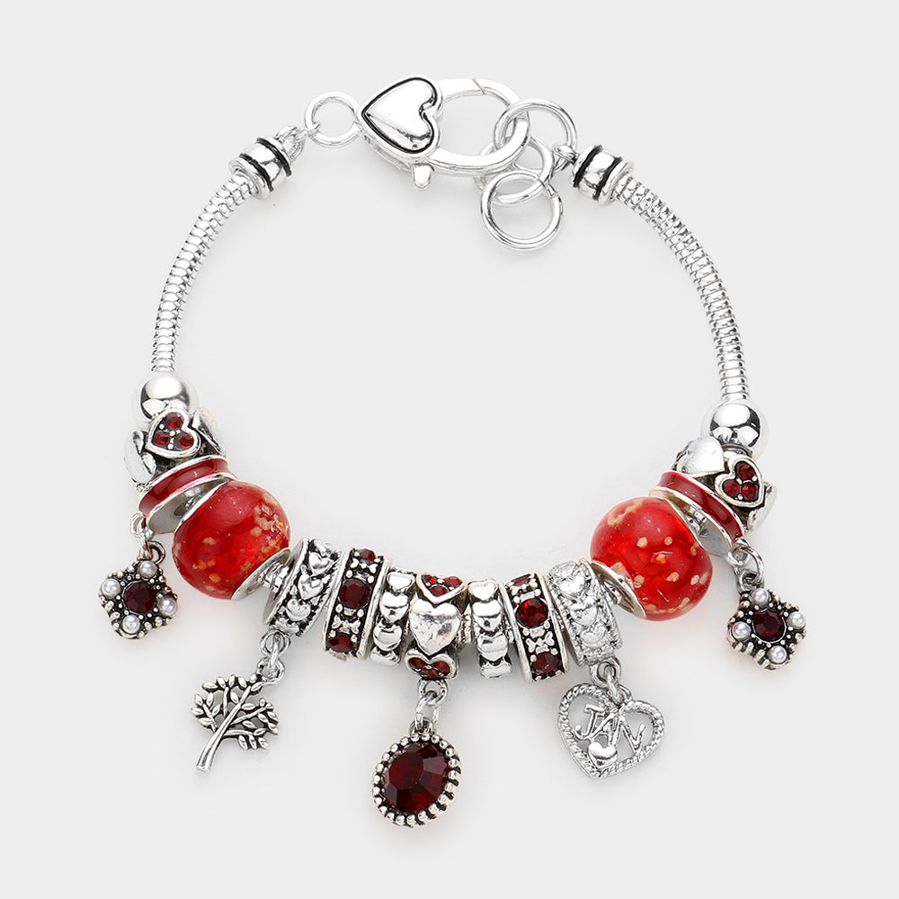 Meses - Pulsera con múltiples charms y dije de corazón con piedra natal