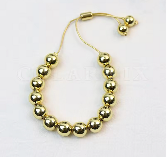 07803636 Pulsera esferas en oro laminado 18k (3 Capas)