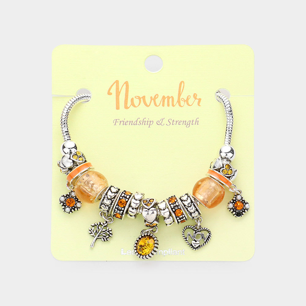Meses - Pulsera con múltiples charms y dije de corazón con piedra natal