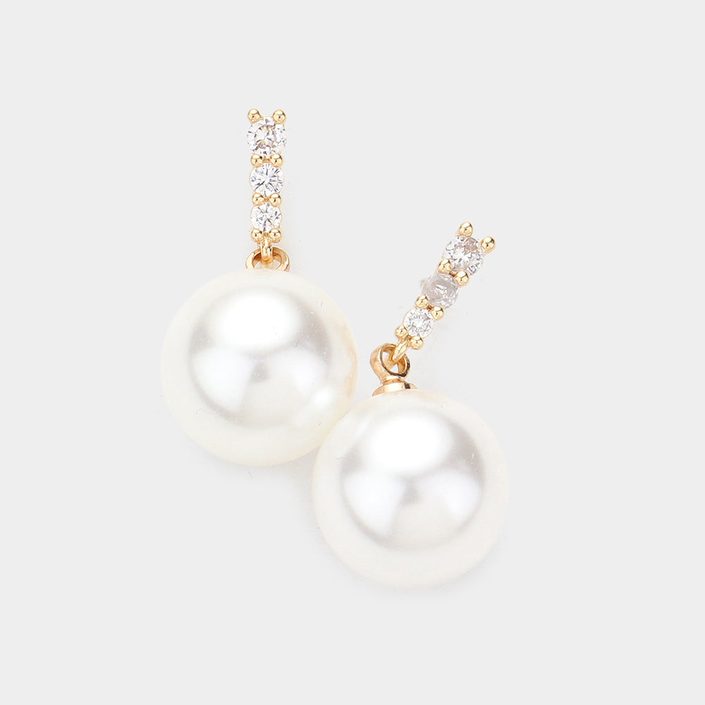 Pendientes colgantes con detalles en brillantes y perlas